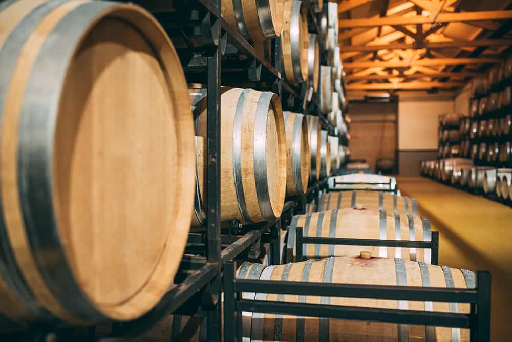 wood-wine-barrels-stored-in-a-winery-on-the-fermen-2021-08-26-20-17-09-utc